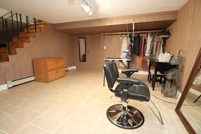 a view of a livingroom with furniture and a window
