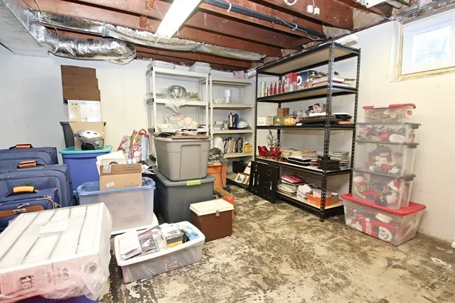 a view of a patio with table and chairs with wooden floor and fence
