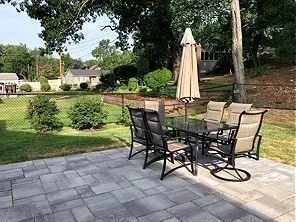 a view of a patio with a table and chairs