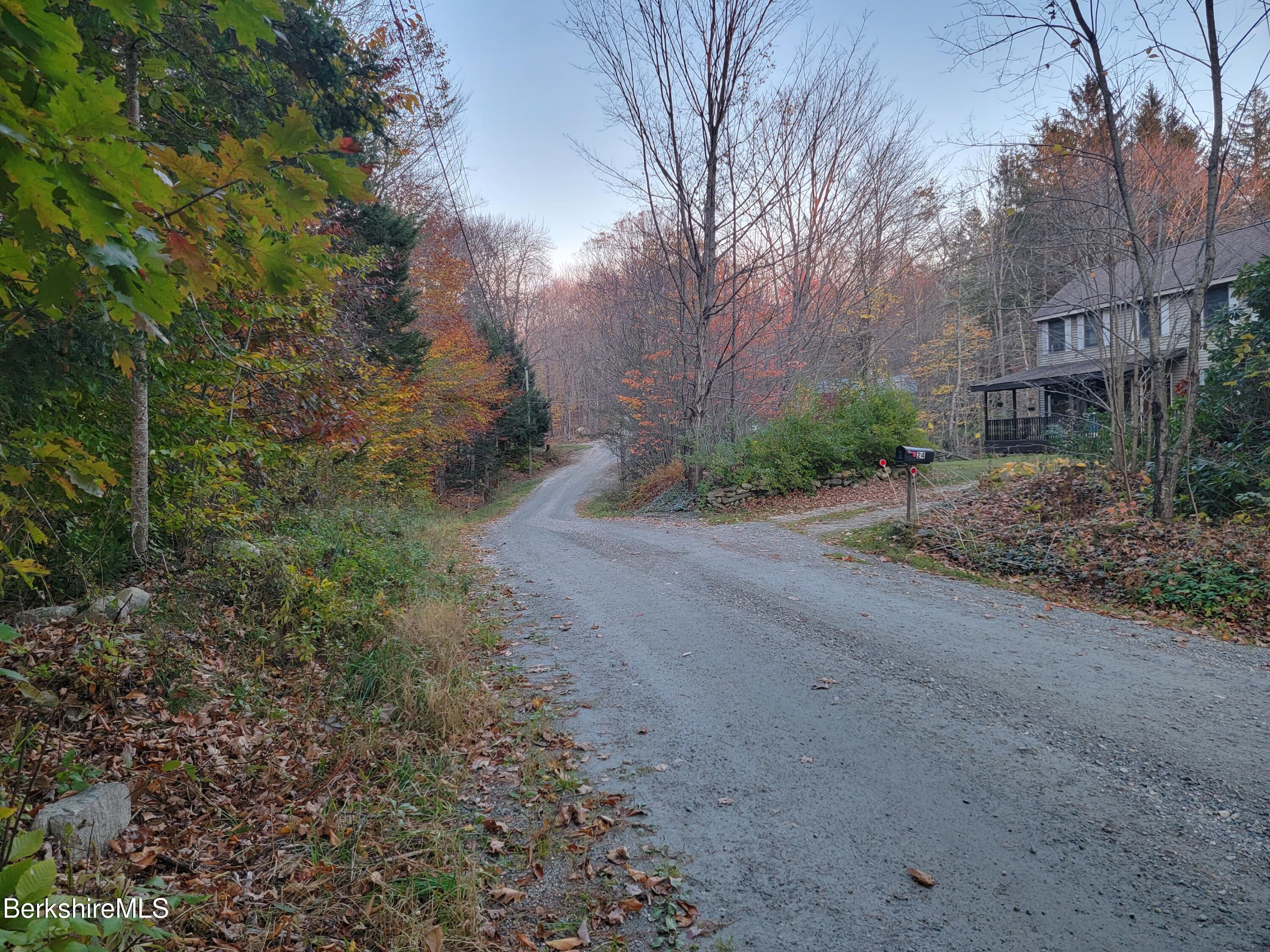 0 Haskell Road Hinsdale, MA 01235 - Photo 3 of 10 a view of a dirt road with a building in the background