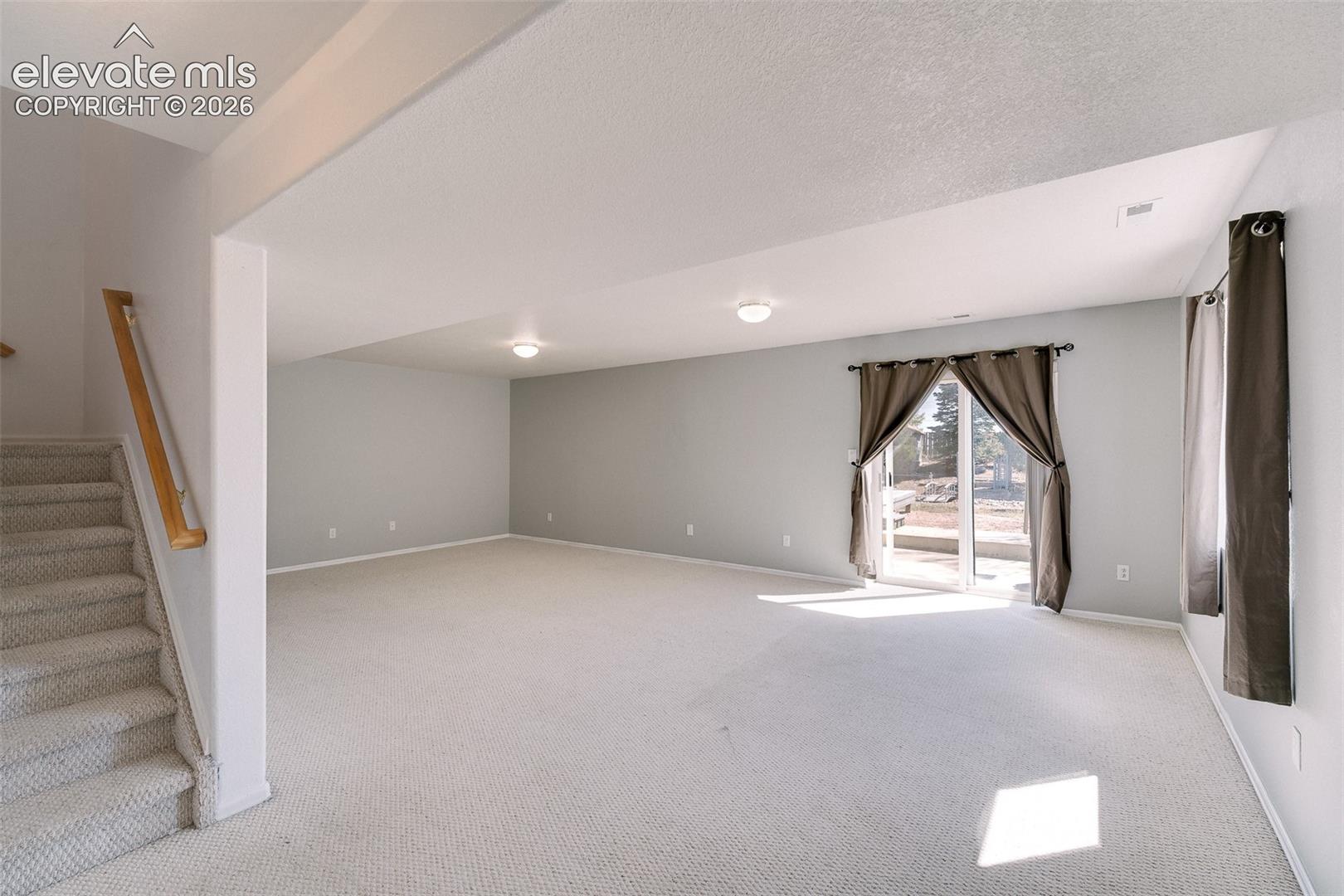 7869 Fort Smith Road Peyton, CO 80831 - Photo 10 of 50 Finished Basement with large, walk out Family Room.