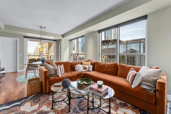 a living room with furniture and a large window