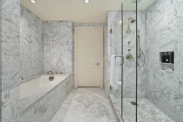 a bathroom with a bathtub and shower