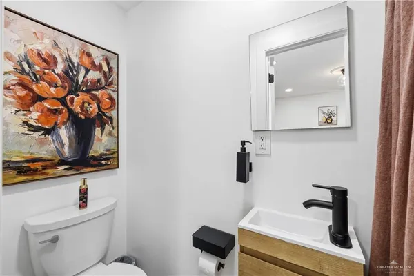 a bathroom with a sink a mirror and shower