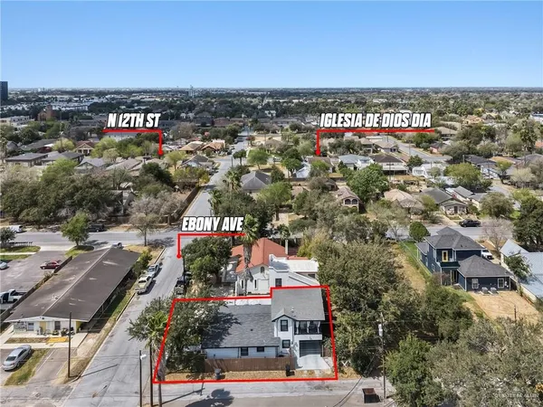 an aerial view of residential houses with outdoor space