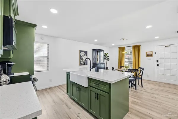 a view of a dining room with furniture and window