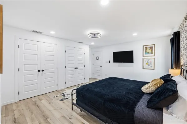 a bathroom with a double vanity sink toilet and shower