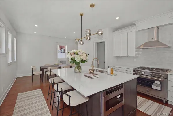 a kitchen that has a table and chairs in it
