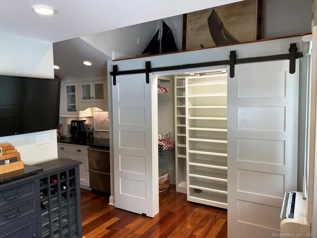 a kitchen with stainless steel appliances a refrigerator and cabinets