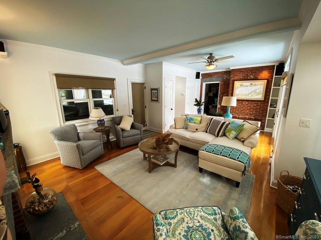 27 Brightwater Road Old Lyme, CT 06371 - Photo 16 of 34 a living room with furniture and a couch