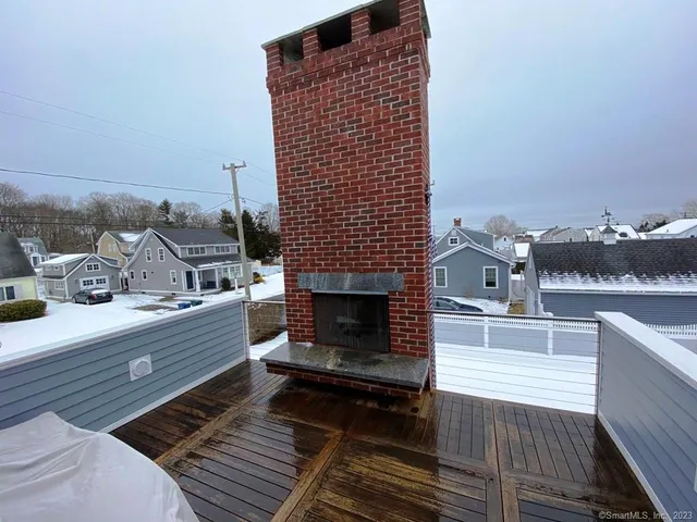 a terrace of a house with outdoor seating
