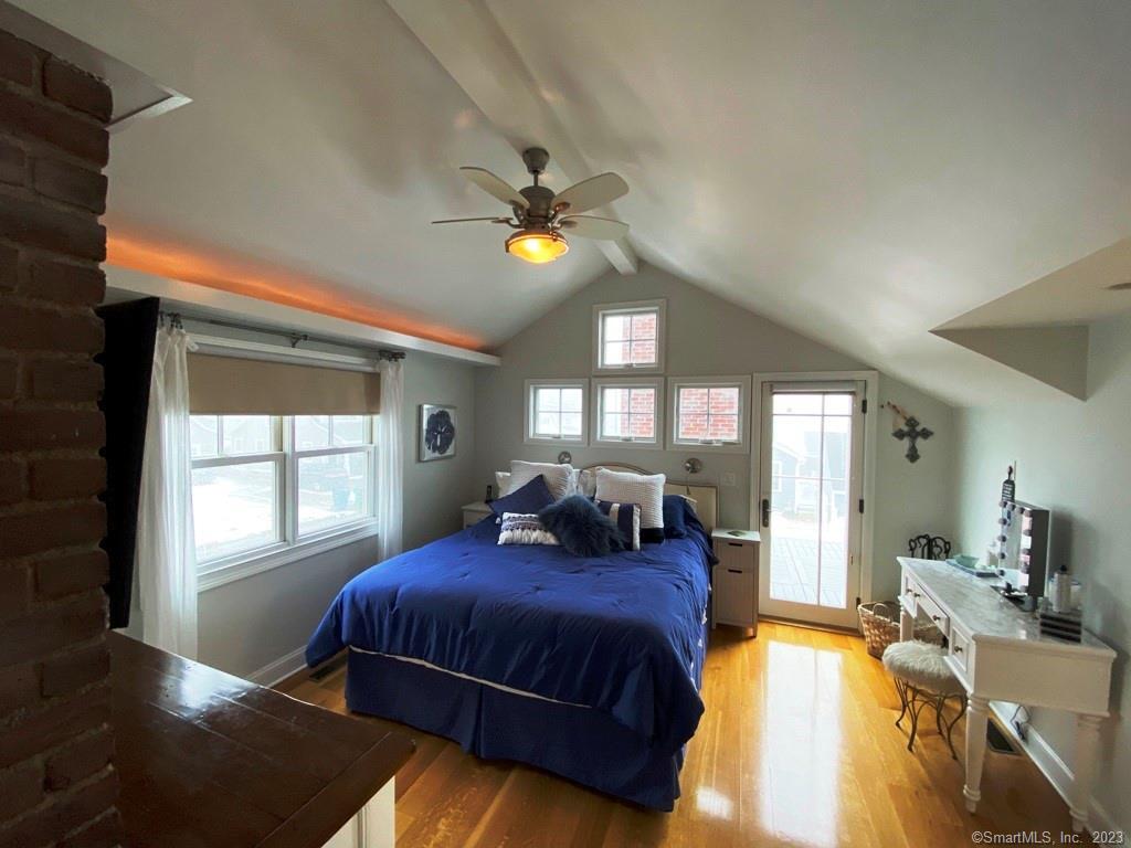 27 Brightwater Road Old Lyme, CT 06371 - Photo 28 of 34 a spacious bedroom with a bed and ceiling fan