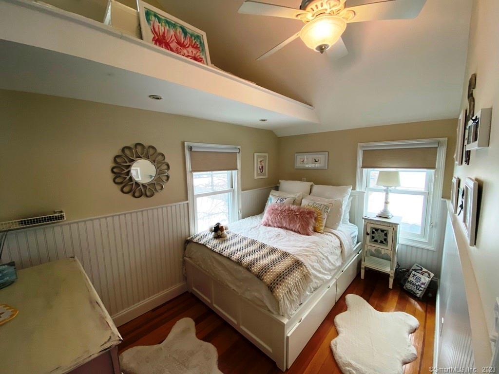 27 Brightwater Road Old Lyme, CT 06371 - Photo 32 of 34 a bedroom with a bed and window