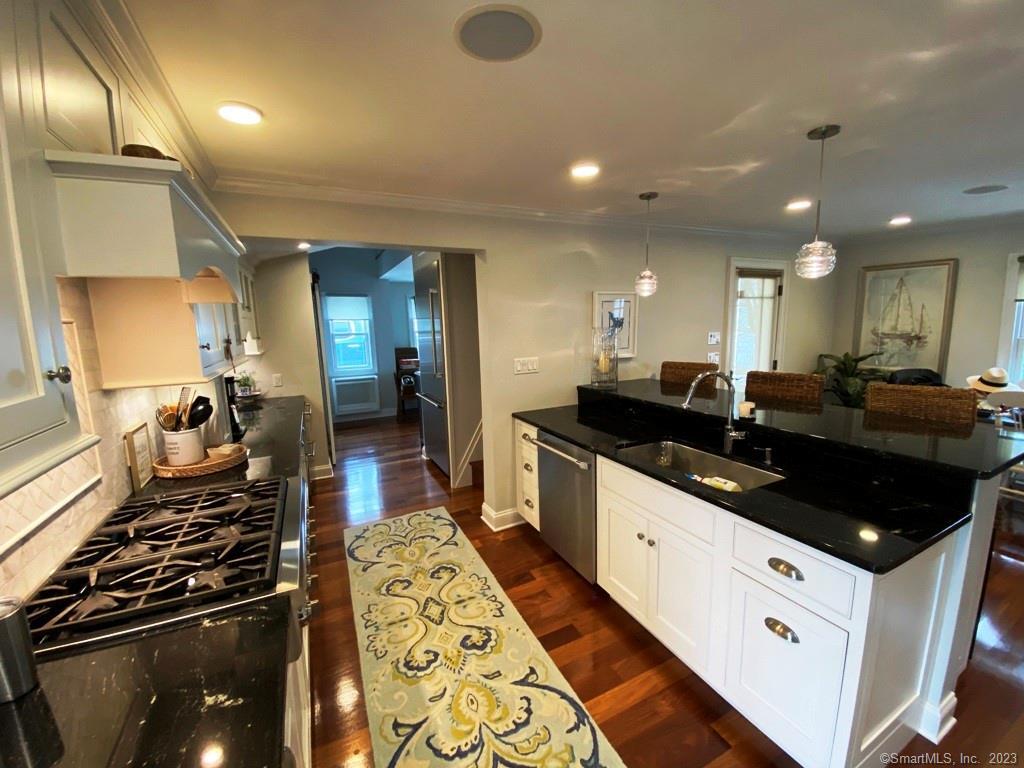 27 Brightwater Road Old Lyme, CT 06371 - Photo 9 of 34 a large white kitchen with lots of counter space