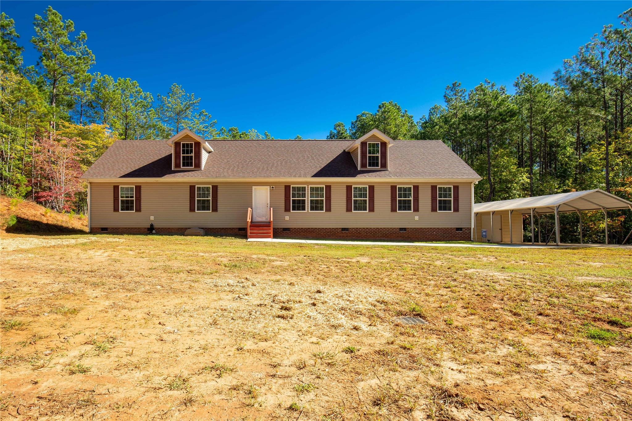 1652 Goings Road Chester, SC 29706 - Photo 1 of 35 a front view of a house with a garden