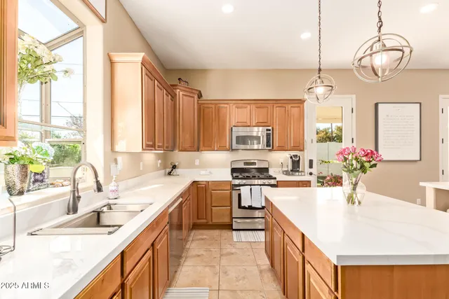 a view of a a dining room with furniture window and wooden floor