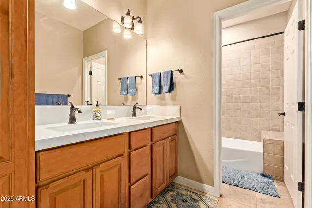 a spacious bedroom with a bed and a window