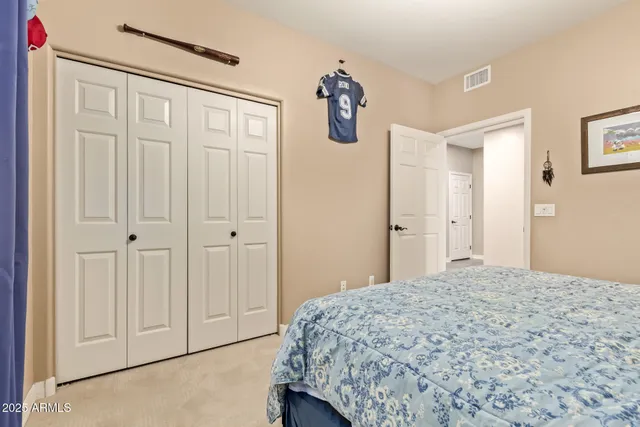 a bathroom with a double vanity sink a mirror and shower