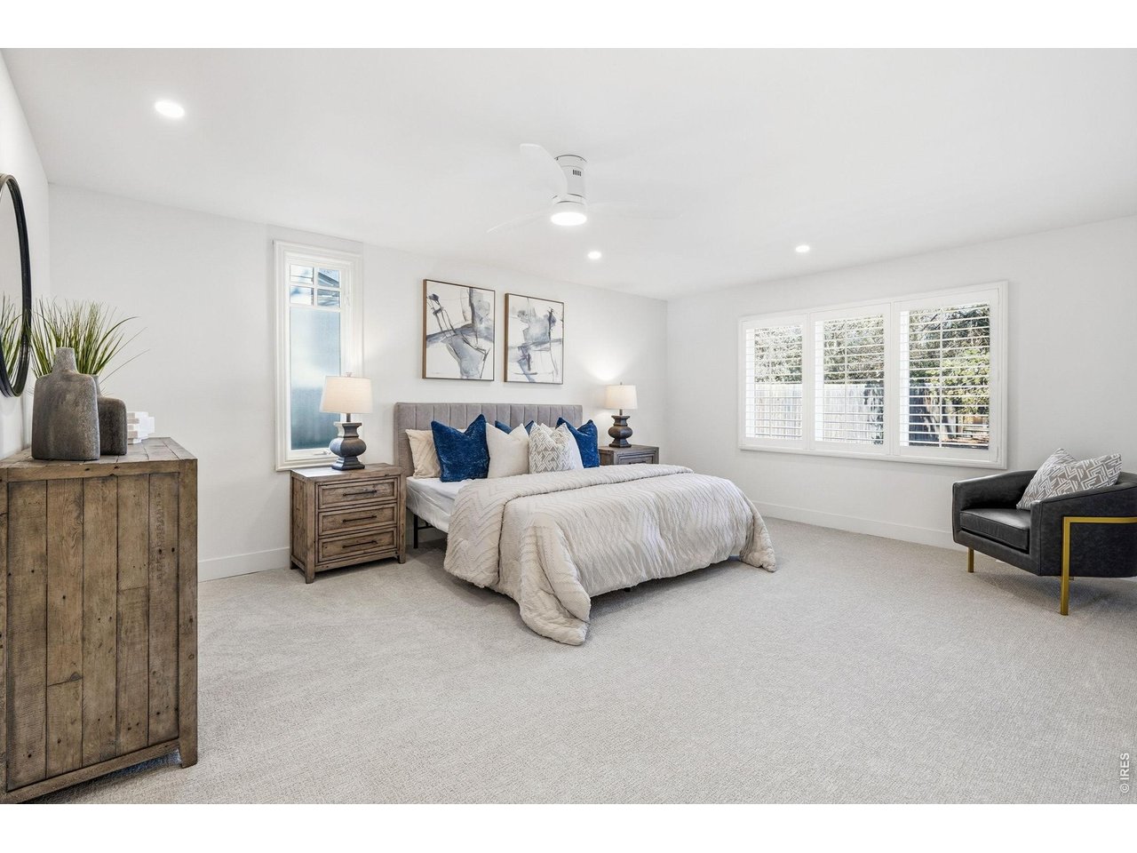 4788 Briar Ridge Trail Boulder, CO 80301 - Photo 16 of 45 Spacious primary suite featuring a walk-in closet, en-suite bathroom with modern fixtures, and serene views of the yard