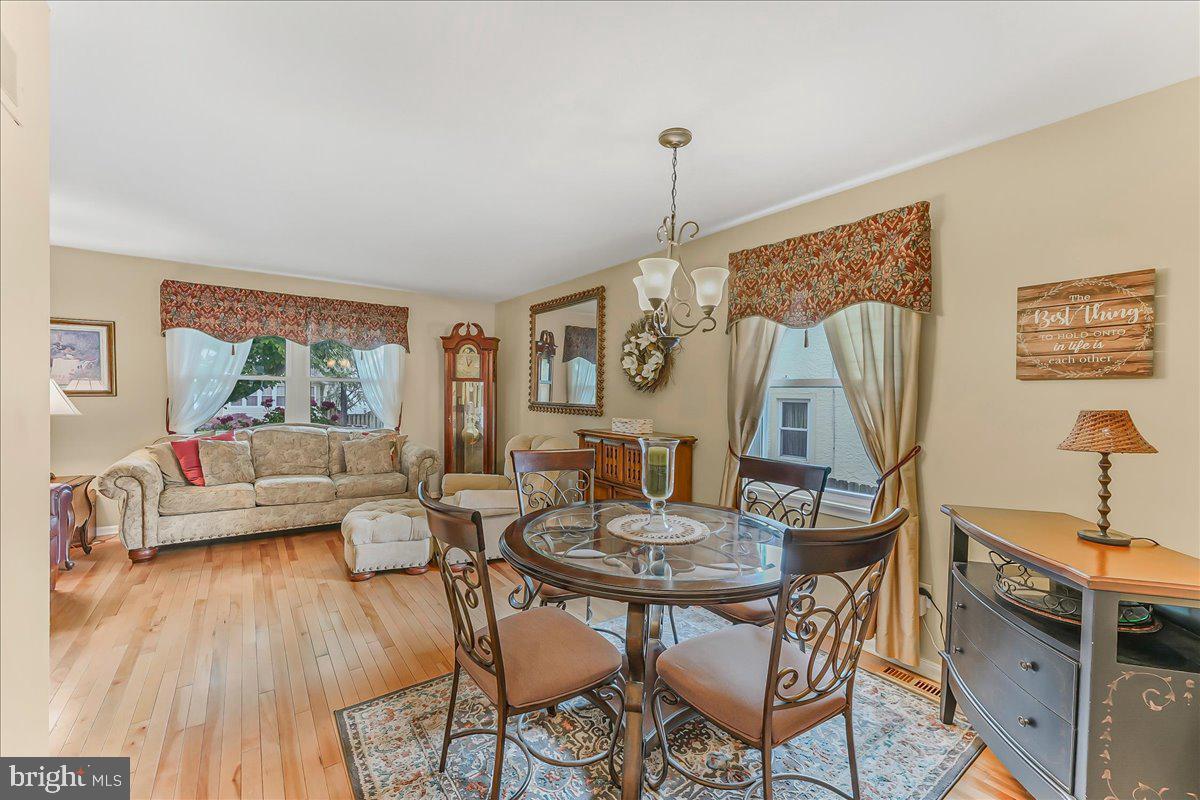 502 Ryanard Road Wallingford, PA 19086 - Photo 11 of 38 a view of a dining room with furniture window and wooden floor