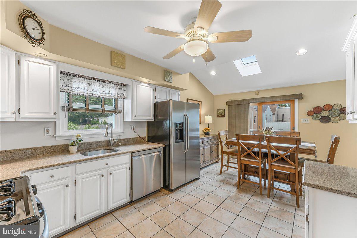 502 Ryanard Road Wallingford, PA 19086 - Photo 12 of 38 a kitchen with a dining table and chairs