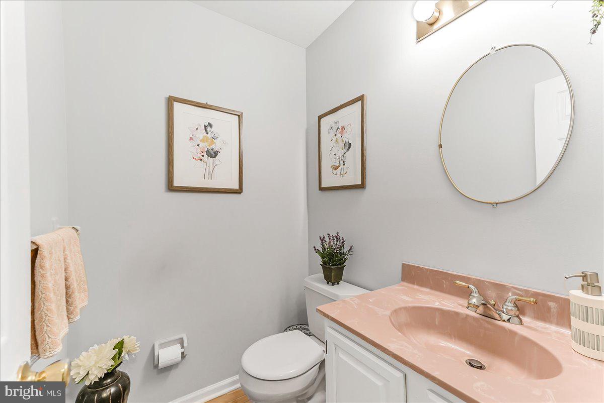 502 Ryanard Road Wallingford, PA 19086 - Photo 20 of 38 a bathroom with a toilet a sink and mirror