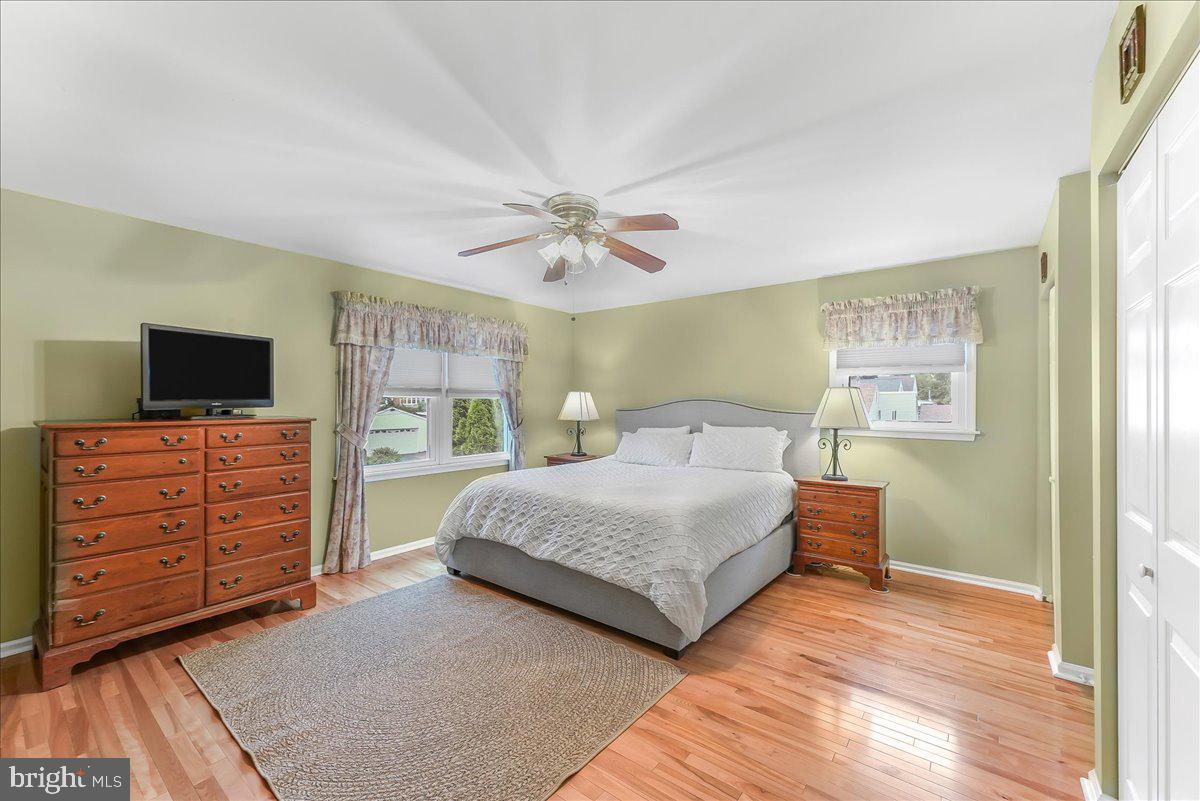 502 Ryanard Road Wallingford, PA 19086 - Photo 22 of 38 a bedroom with a large bed and a flat screen tv