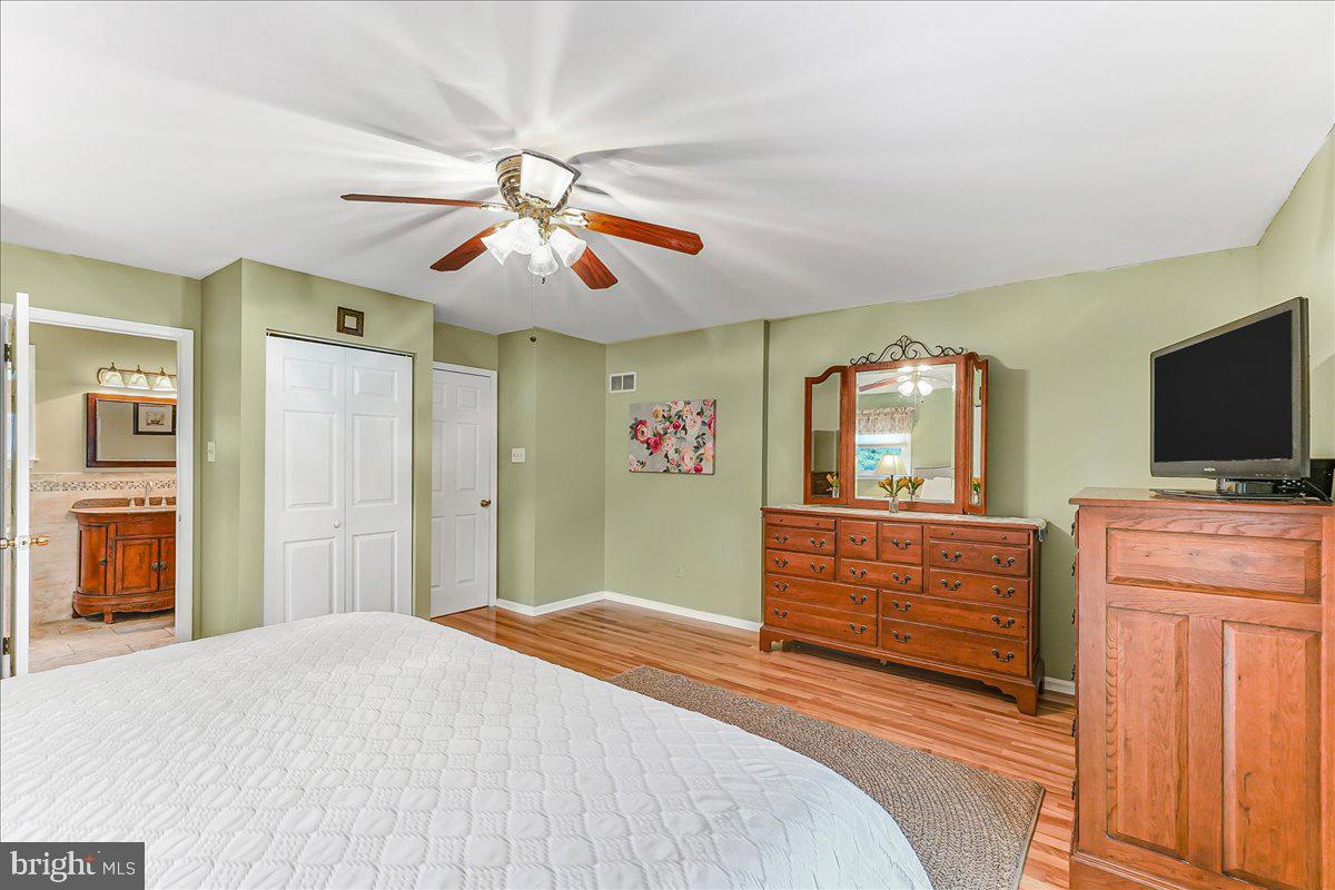 502 Ryanard Road Wallingford, PA 19086 - Photo 23 of 38 a bedroom with a bed and a flat screen tv