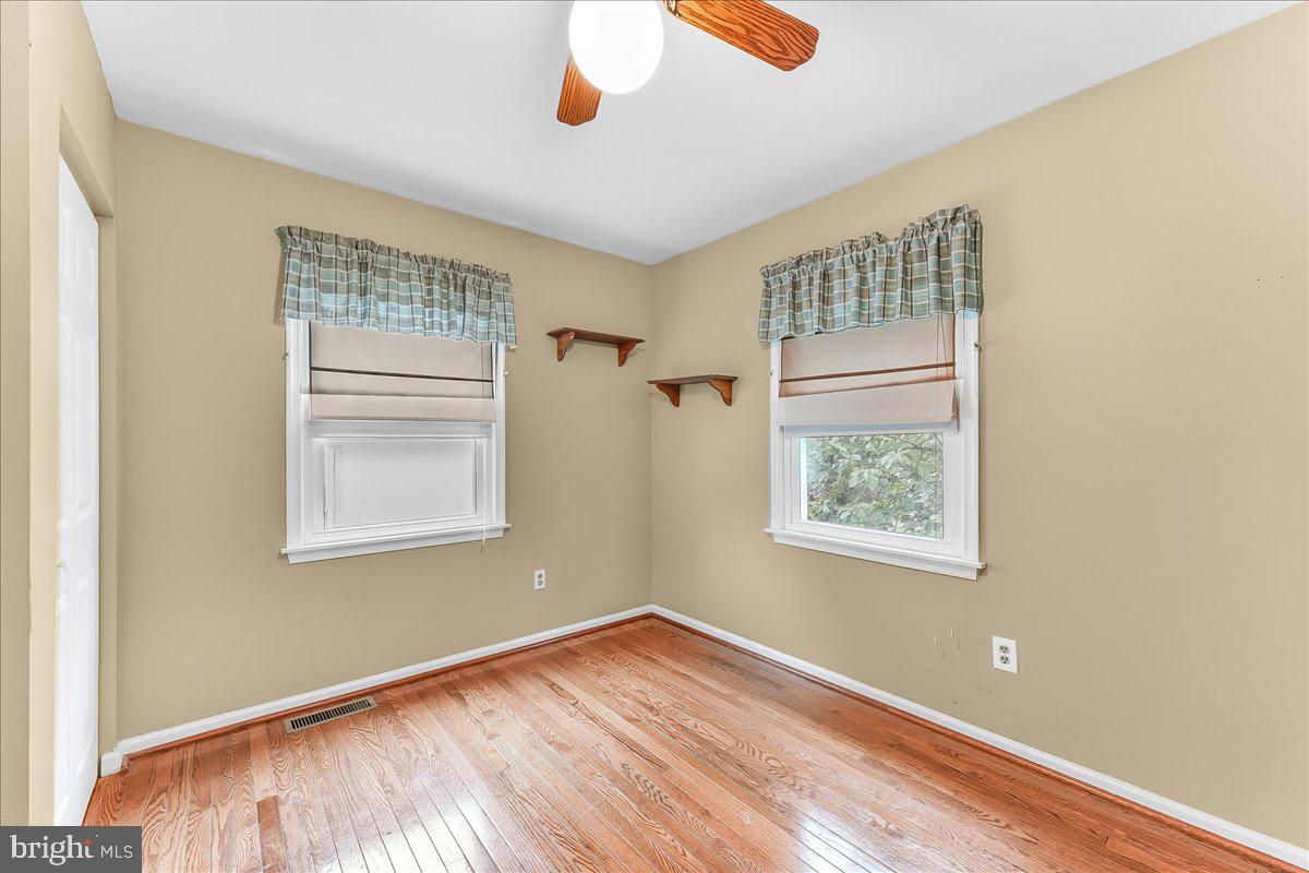 502 Ryanard Road Wallingford, PA 19086 - Photo 24 of 38 a view of empty room with wooden floor and fan