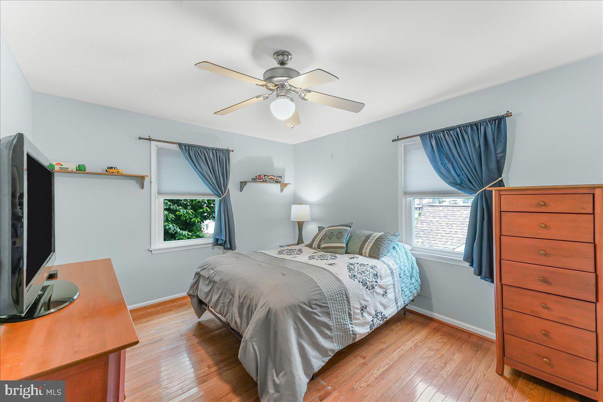 502 Ryanard Road Wallingford, PA 19086 - Photo 26 of 38 a bedroom with a bed and wooden floor