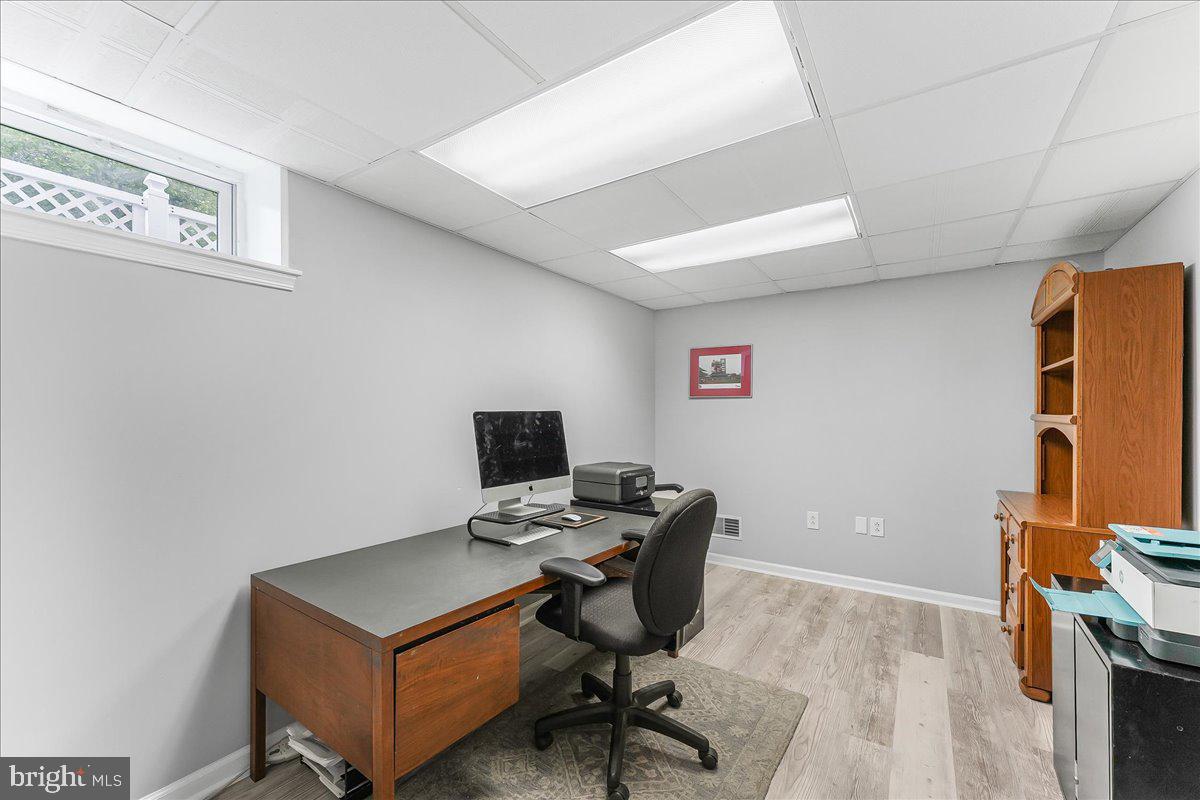 502 Ryanard Road Wallingford, PA 19086 - Photo 32 of 38 a view of a workspace with furniture and a window