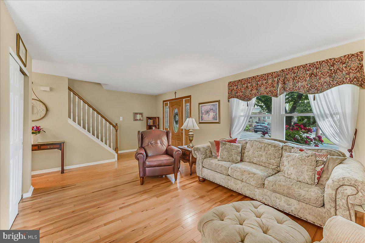 502 Ryanard Road Wallingford, PA 19086 - Photo 4 of 38 a living room with furniture and a wooden floor