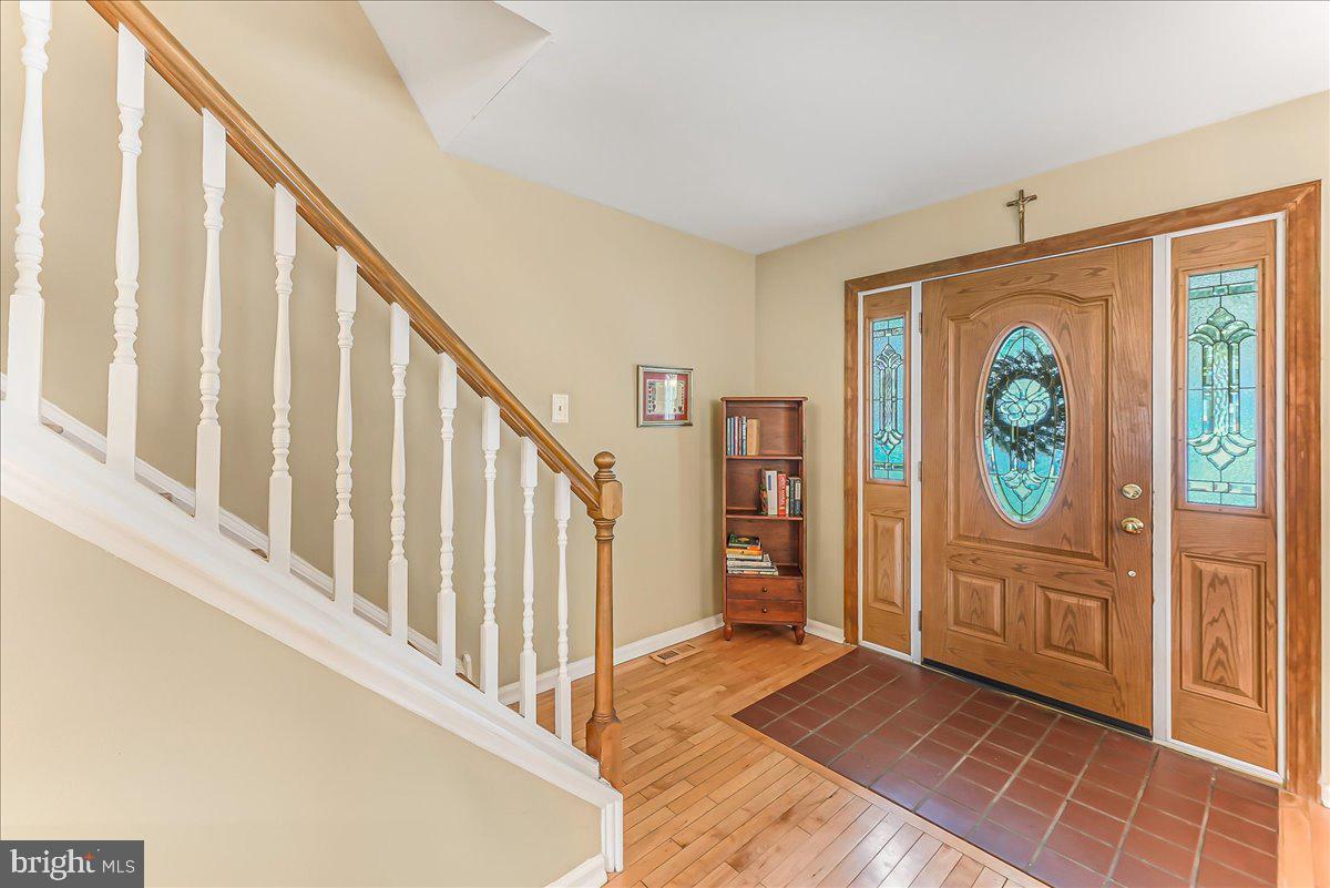 502 Ryanard Road Wallingford, PA 19086 - Photo 7 of 38 a view of an entryway with wooden floor