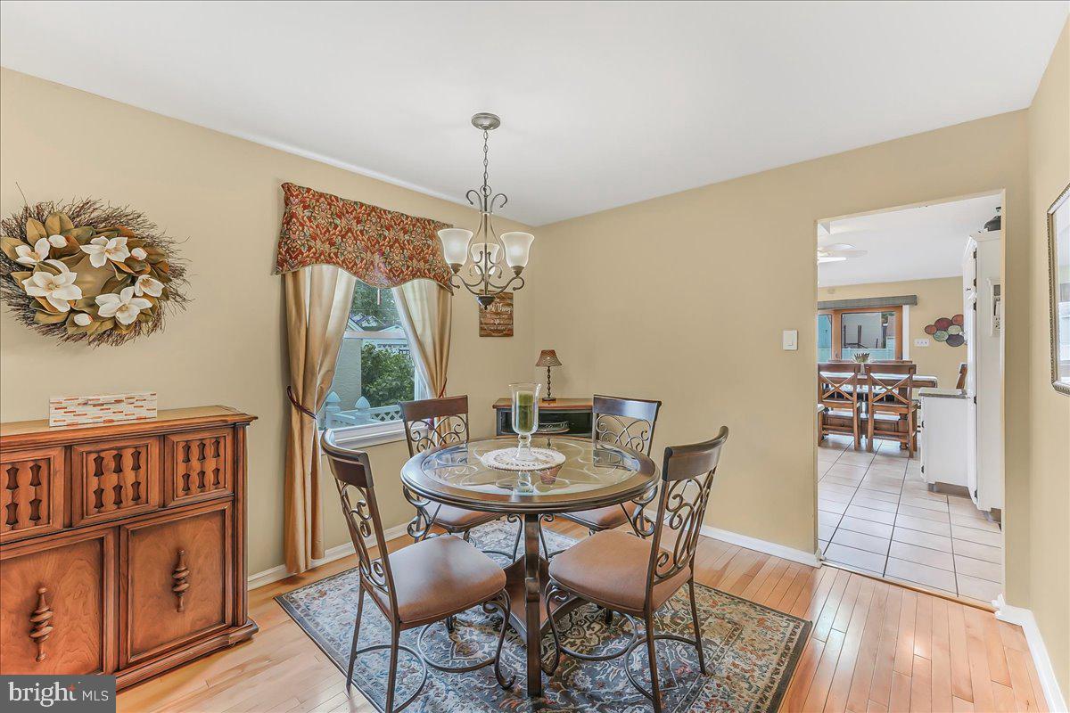 502 Ryanard Road Wallingford, PA 19086 - Photo 10 of 38 a view of a dining room with furniture window and wooden floor