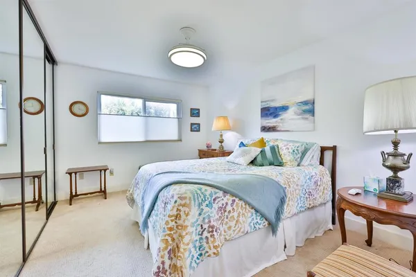 a bedroom with a bed and window