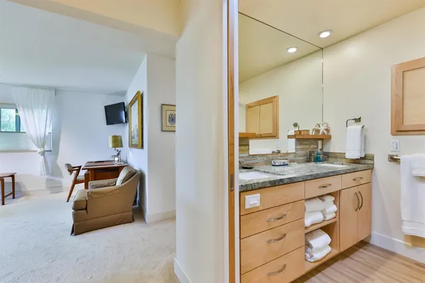 a bathroom with a sink and a mirror
