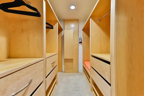 a view of walk in hallway with wooden floor