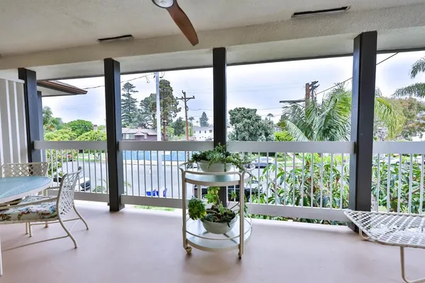 a room with furniture and large windows