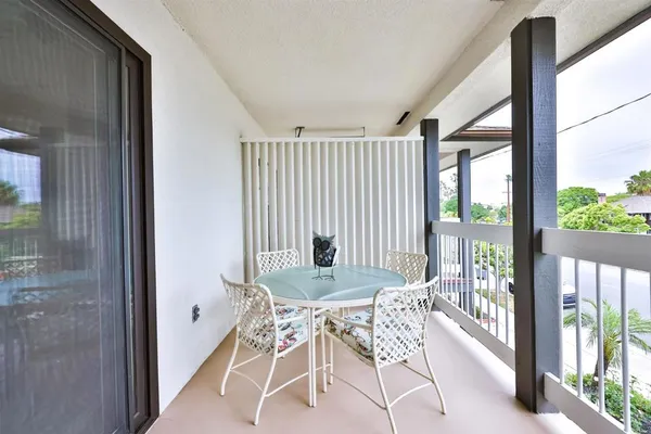 a dining room with furniture and front door