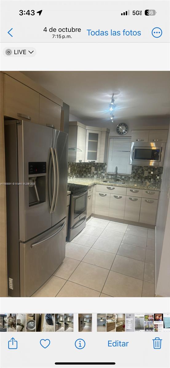 758 East 20th Street, Unit 2 Hialeah, FL 33013 - Photo 2 of 3 a kitchen with a stove and a refrigerator