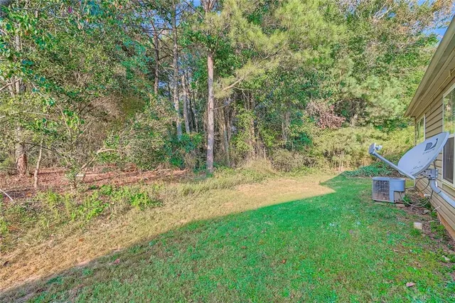 a view of a yard with a tree