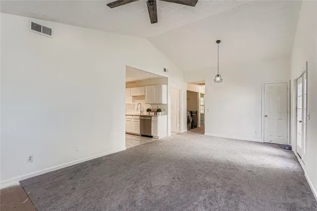 a view of a kitchen with a sink and cabinets