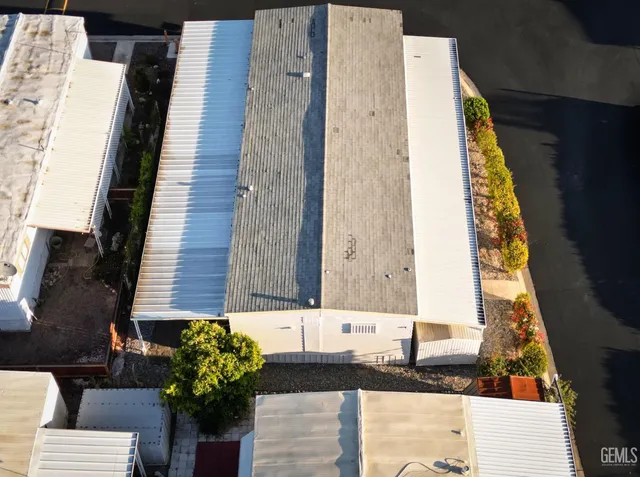 an aerial view of a residential apartment building with a city view