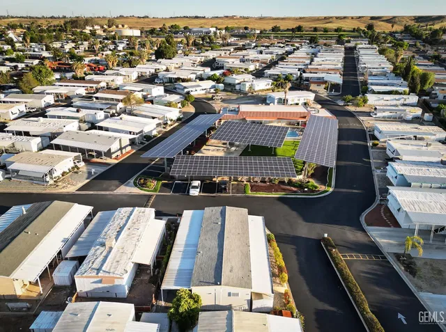 an aerial view of a house with a ocean view