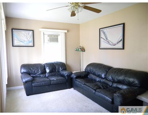 85 Morningside Road Colonia, NJ 07067 - Photo 3 of 16 a living room with furniture and a couch