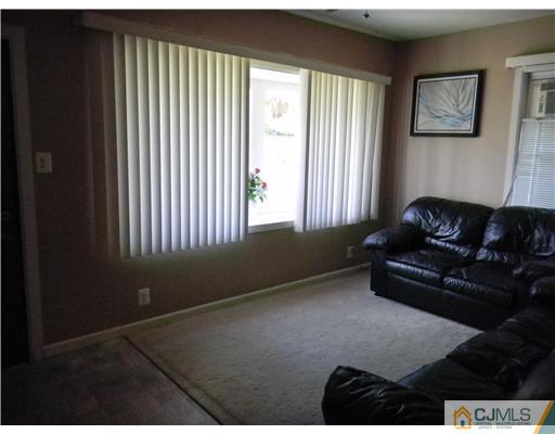 85 Morningside Road Colonia, NJ 07067 - Photo 4 of 16 a living room with furniture and a window