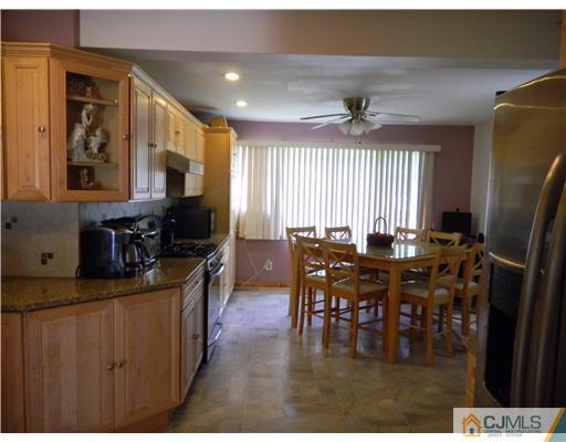 85 Morningside Road Colonia, NJ 07067 - Photo 8 of 16 a view of a dining room with furniture