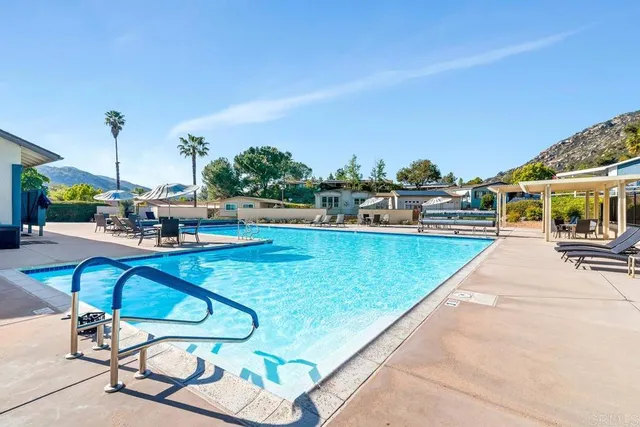 a view of swimming pool with chairs
