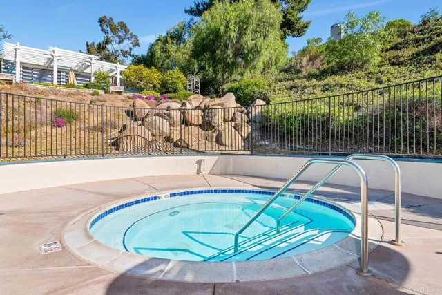 a view of a swimming pool with a chairs