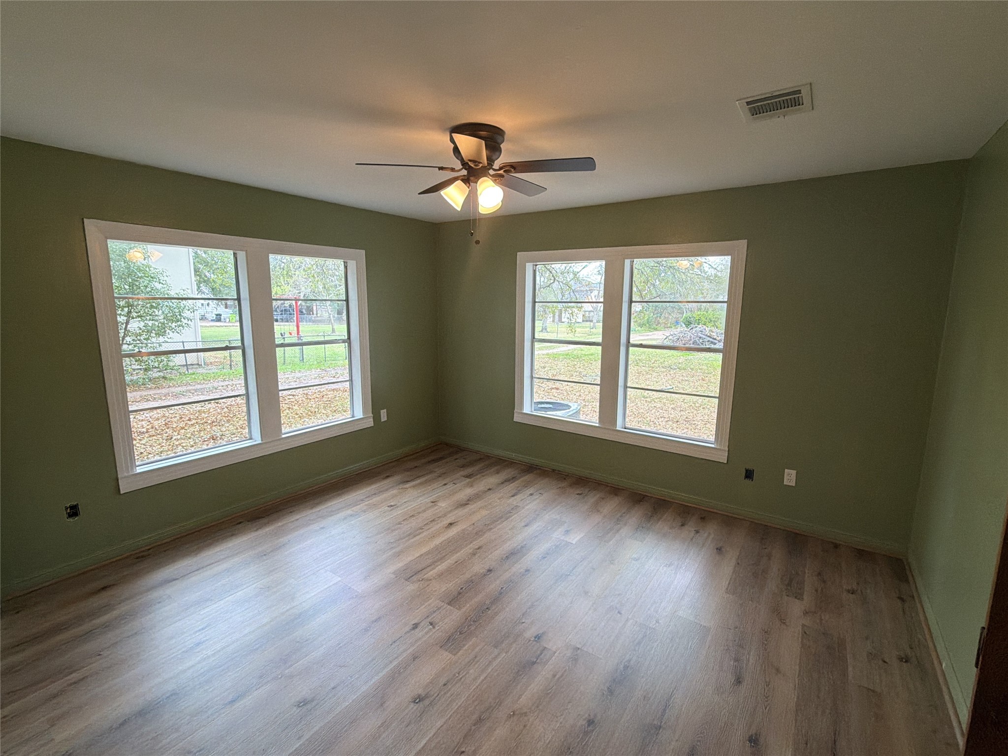 3604 Rychlik Drive Rosenberg, TX 77471 - Photo 3 of 13 a view of an empty room with wooden floor and a window